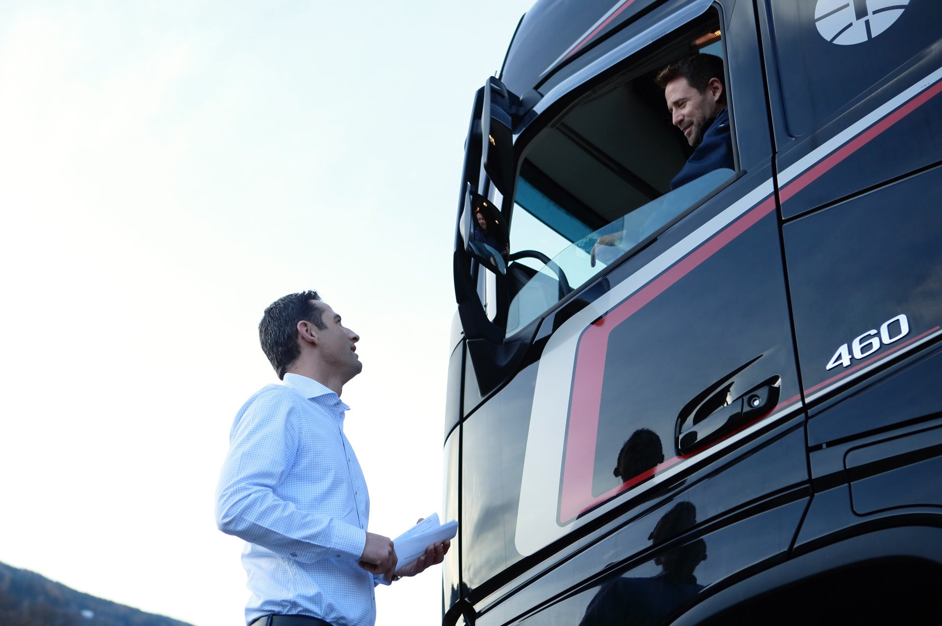 Andreas Fluckinger talking to a truck driver